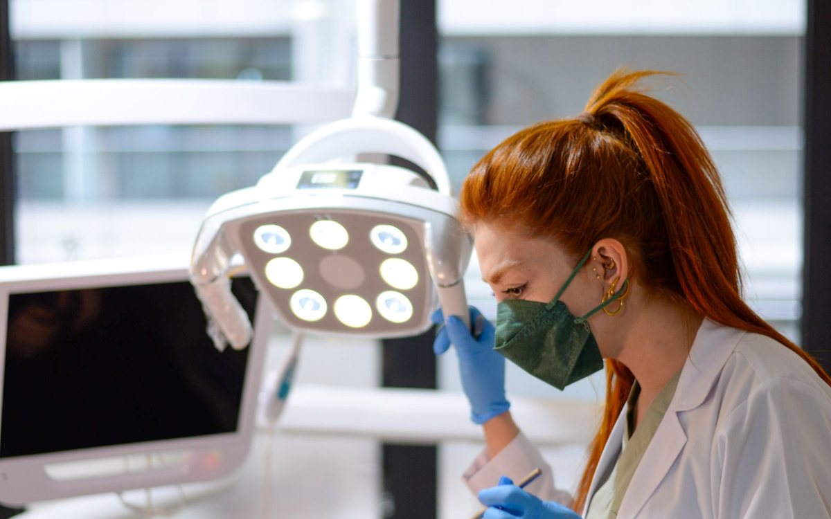 A dentist treating a patient in a modern clinic