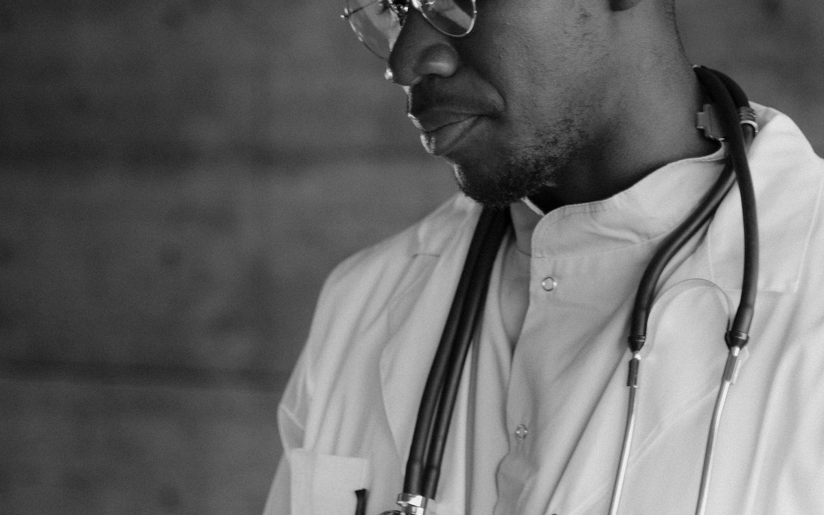 A doctor reviewing an X-ray in a clinic